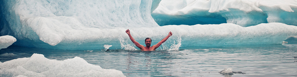 Image of Wim Hof swimming in icy waters.